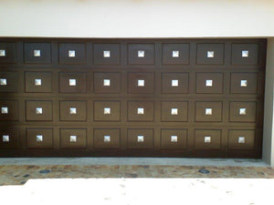 Garage door with square pyramid cap decor hardware / clavos