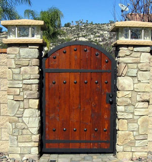 Decorative hardware used on a wooden entrance gate. Simple to install, great for us on the interior as well as the exterior of the home. Choose from a wide variety, all of which are handmade and hand painted. Shop online at www.doorstuds.co.za