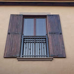 Wooden shutters with decorative hinges and handles