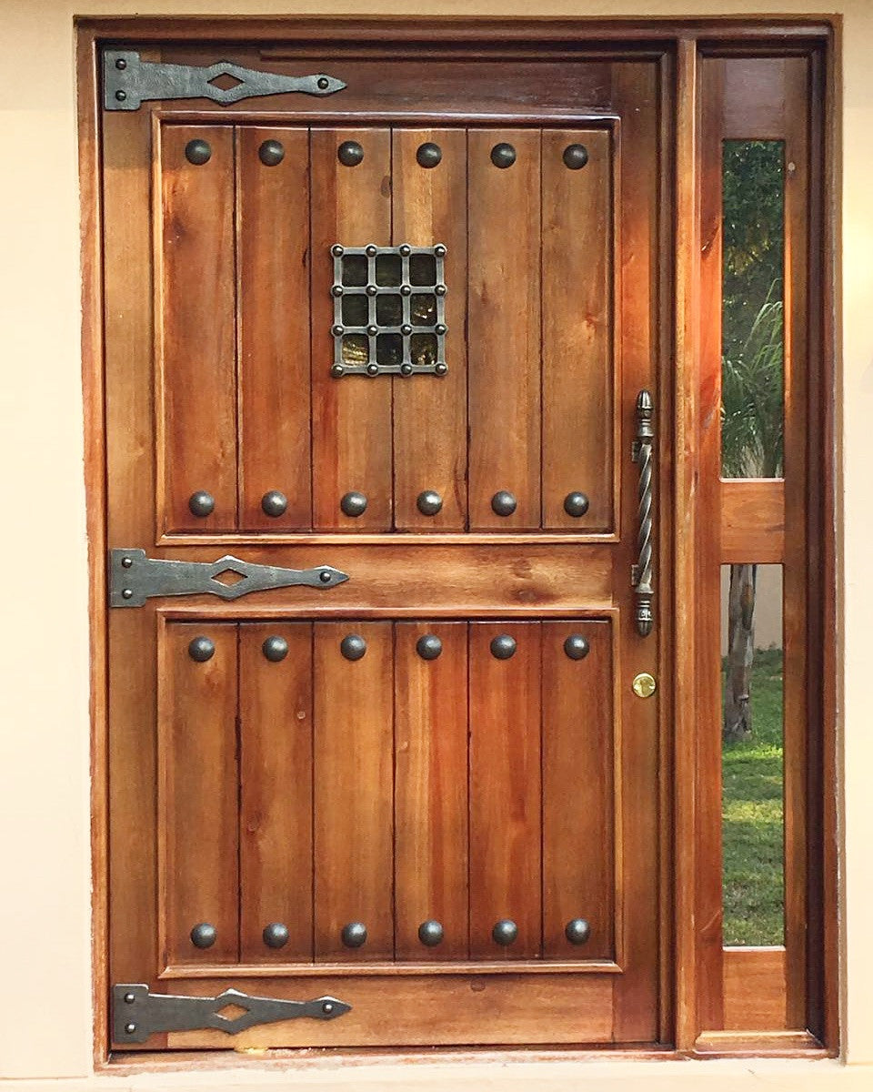 Rustic pivot door with NW/AC6 mock hinges 500 mm long, NW/AC32 door grille and NW/93DD 50 mm plain round cap studs. 