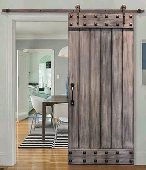 Barn style sliding door with studs to give it that authentic look and feel