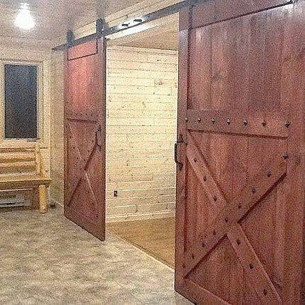 Barn style sliding door with studs to give it that authentic look and feel