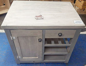 Mock nut and washer home decor studs on a kitchen island cabinet.
