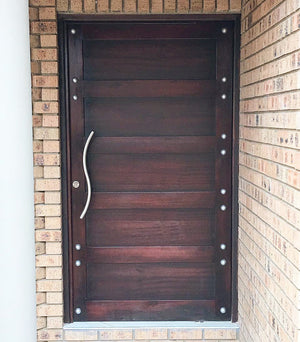 Customised front door with #doorstuds using the NW/93DD chrome round decor stud